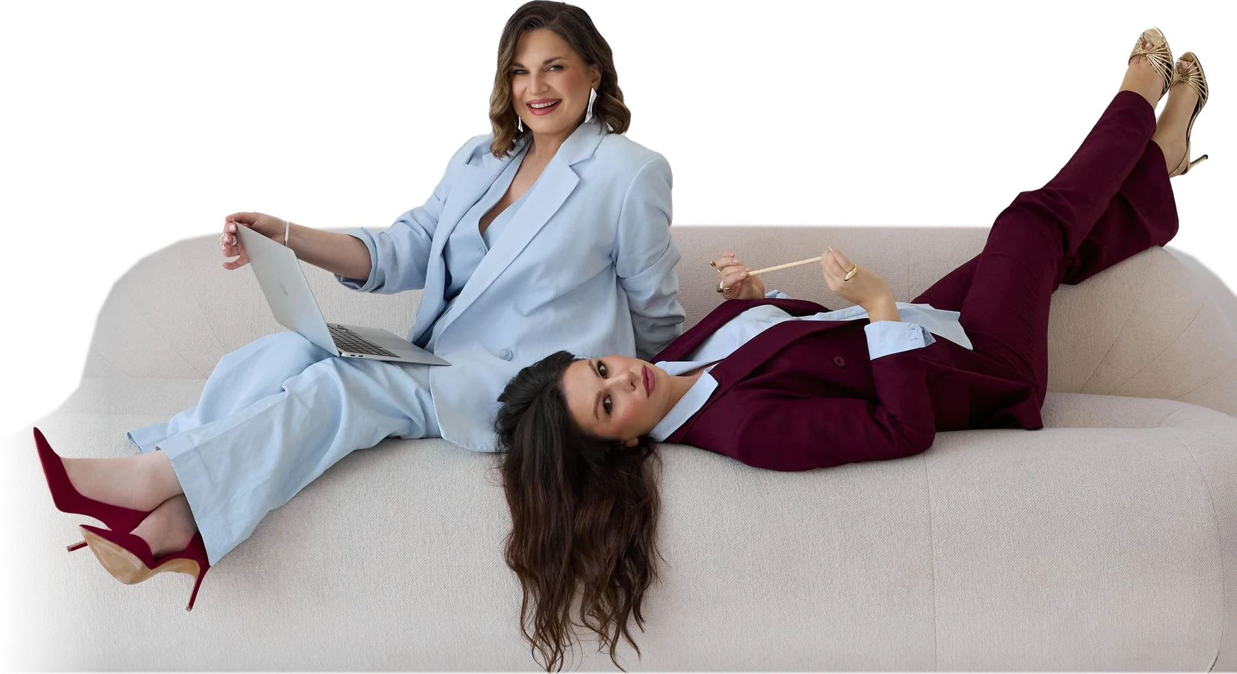 Fanova co-founders Marina Nemchina and Anastasia Korobeinikova on a sofa